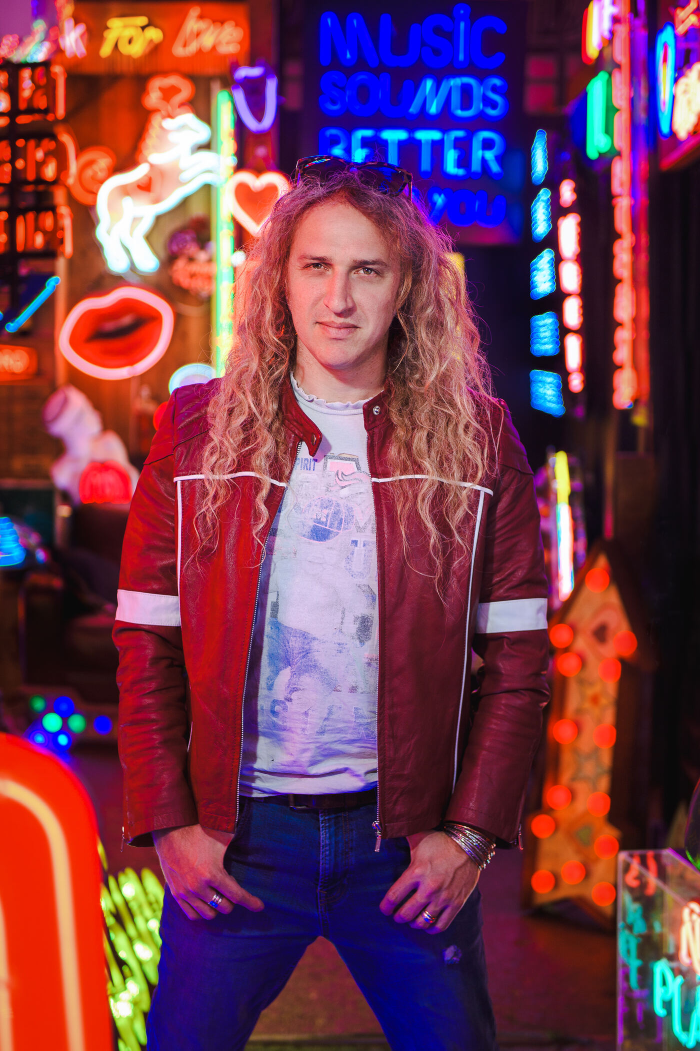 Niro Knox portrait, red leather jacket, Soho neon backdrop